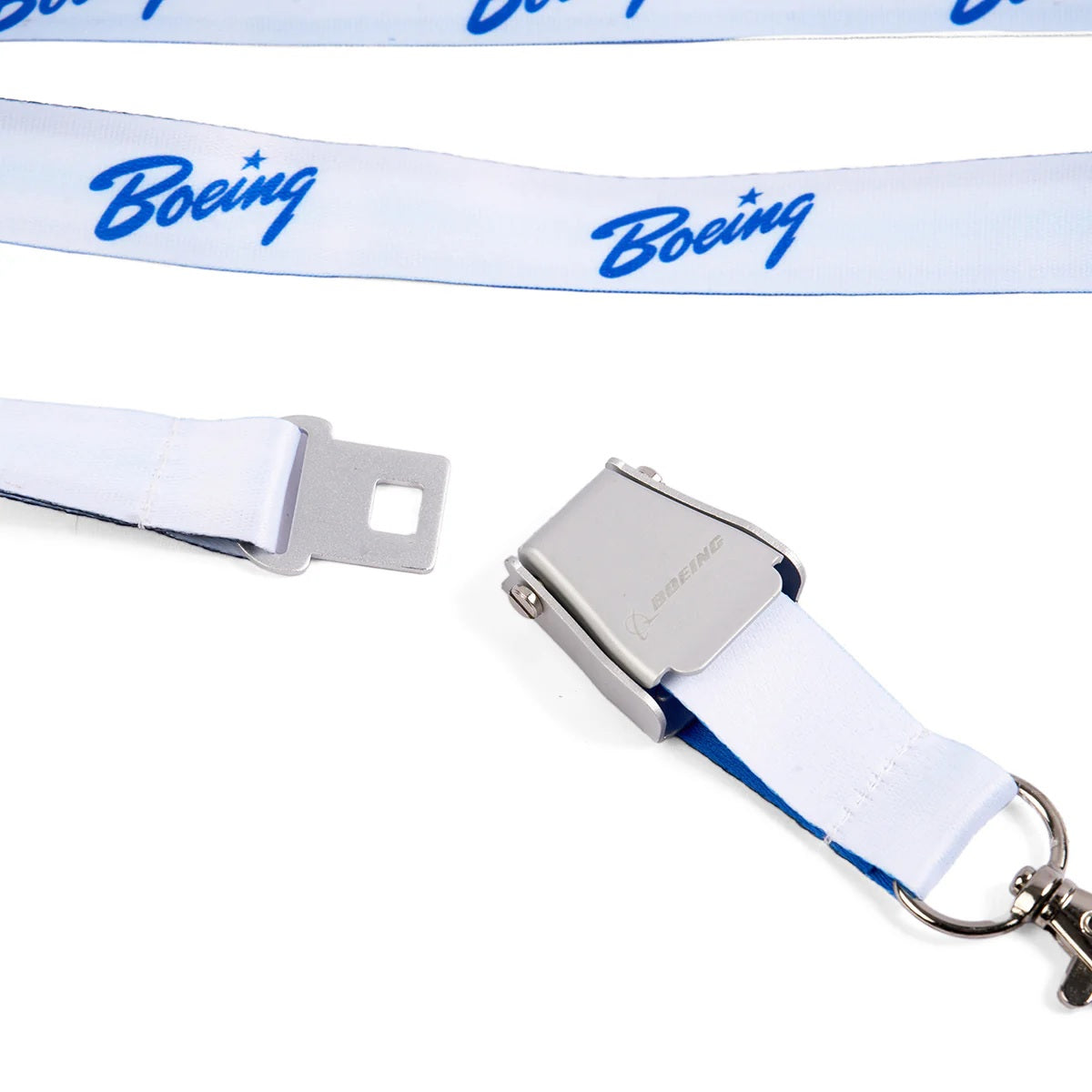 Close-up of Boeing blue seat belt buckle lanyard showing metal buckle and detachable clasp