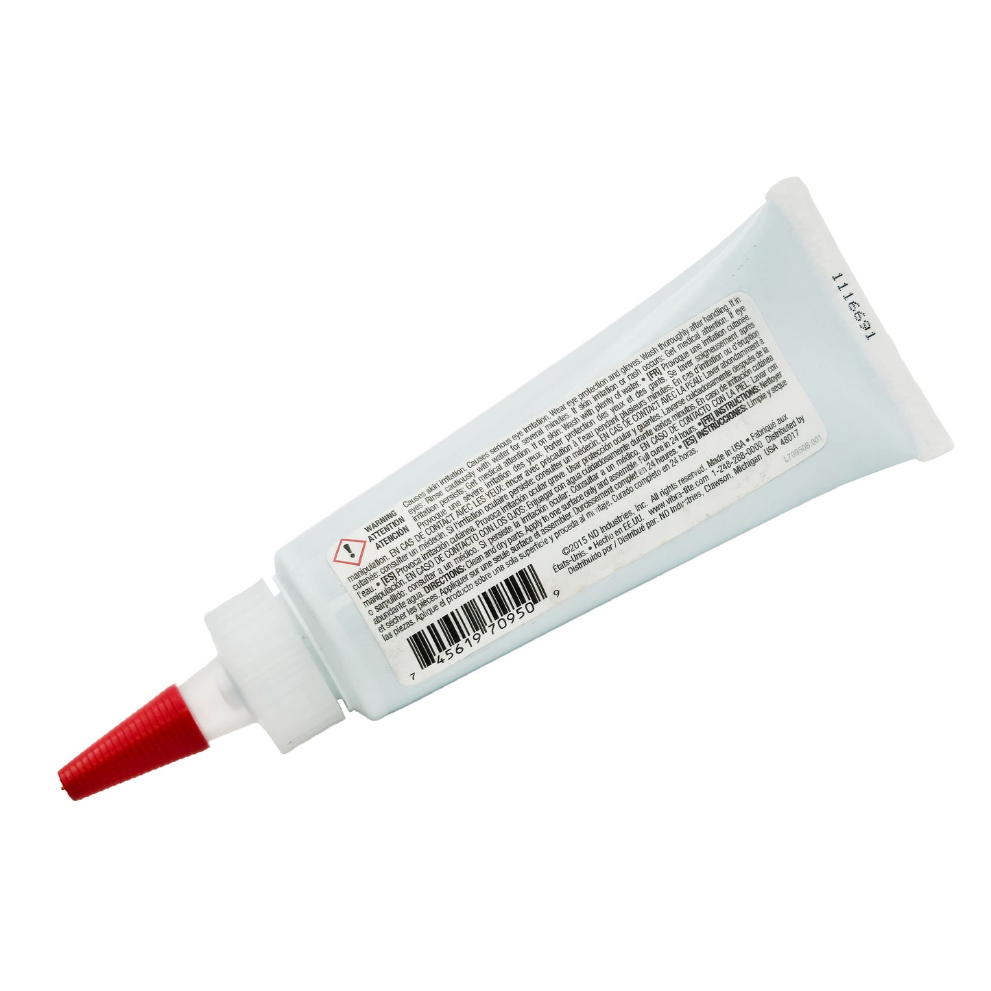 Side view of expired Vibra-Tite 709 Gasket Maker showing product warnings about skin irritation and safe handling instructions.