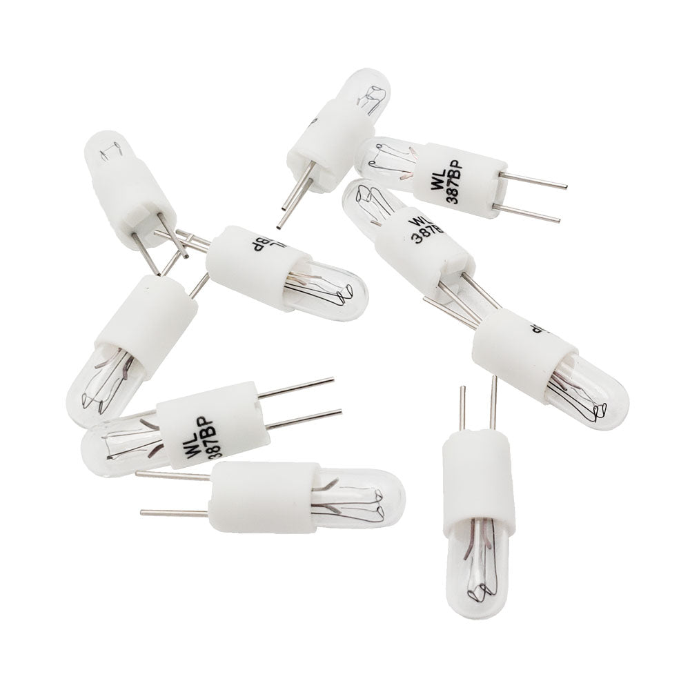 Ten Wamco WL-387BP subminiature aircraft lamps showing white plastic bi-pin housings and clear glass bulbs.