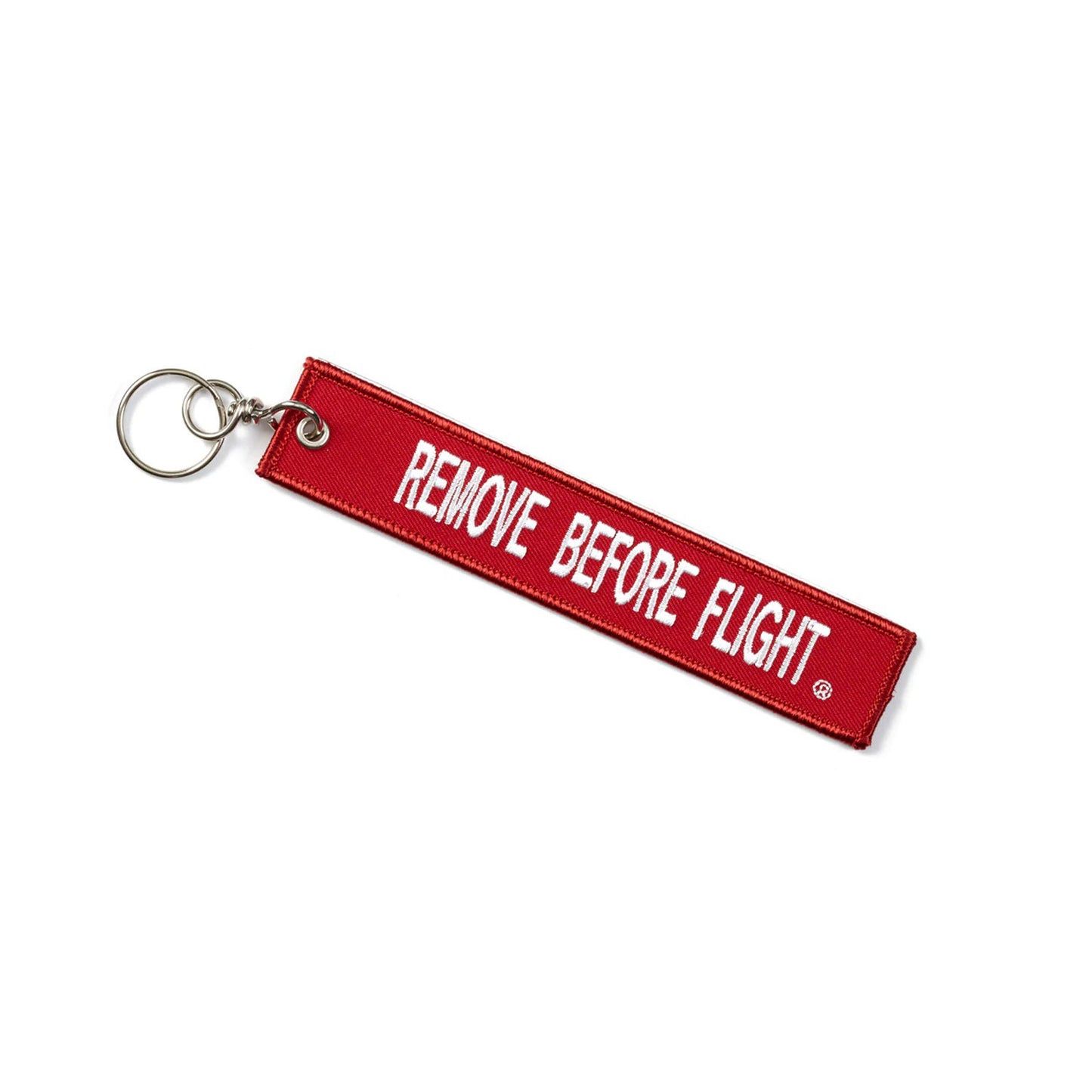 “Remove Before Flight red aviation keychain with Boeing 777X logo back view”