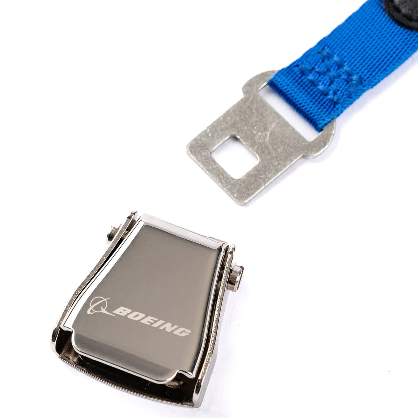 Close-up of Boeing branded metal seat belt buckle keychain detail