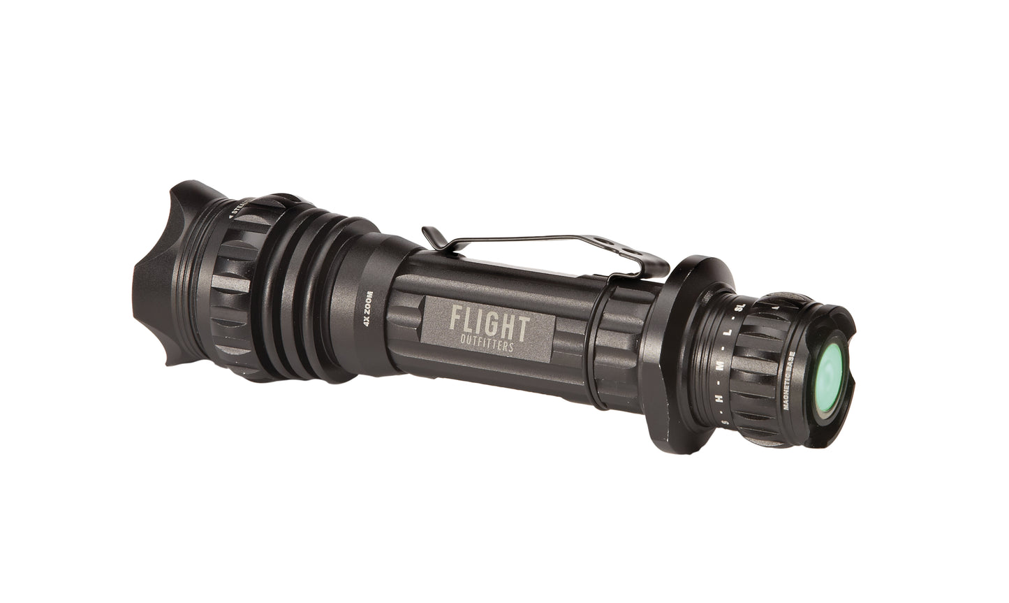 Flight Outfitters Bush Pilot Flashlight side view – horizontal black tactical flashlight with textured grip, stealth ring, magnetic base, and green-tinted lens