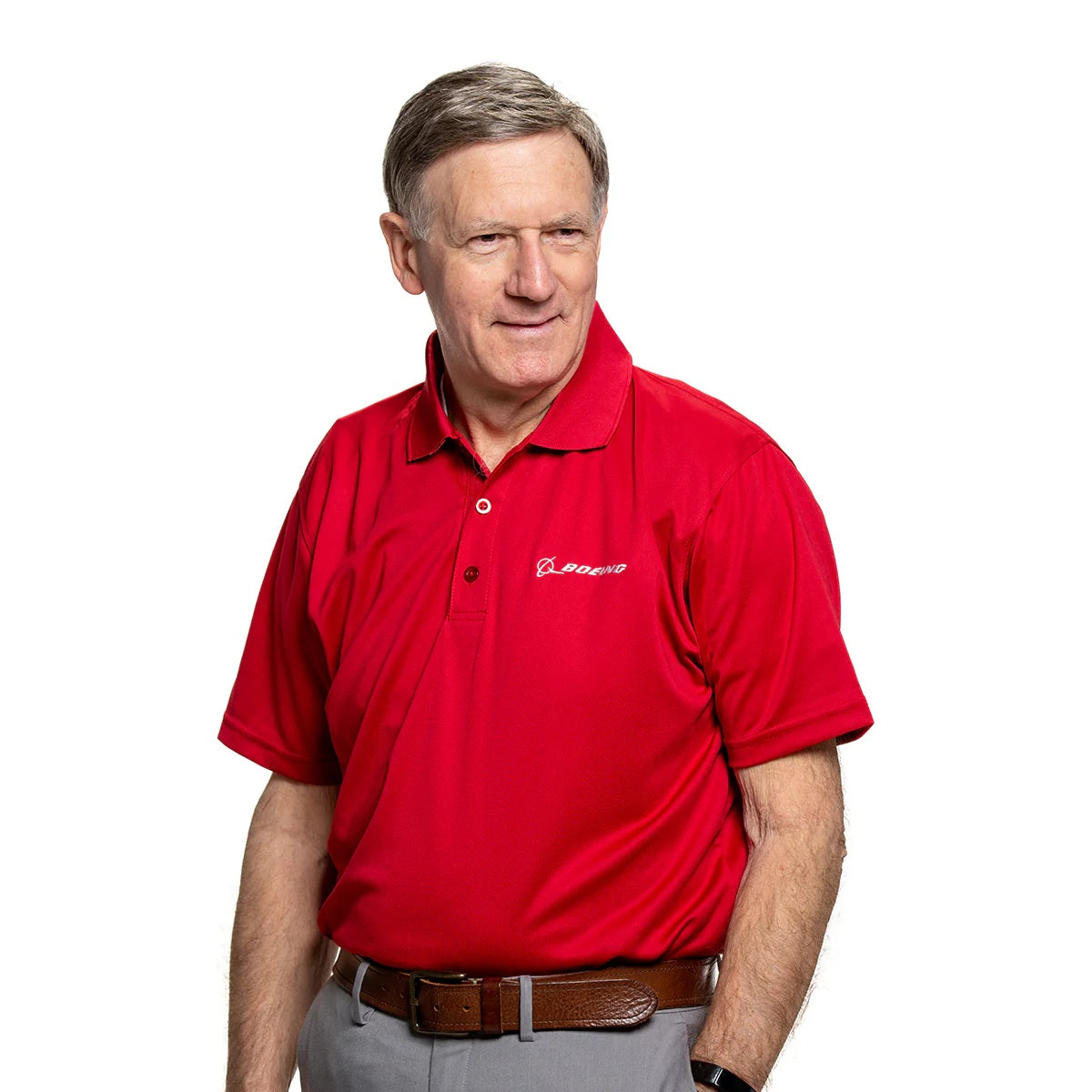 Boeing Signature Omega mesh tech polo worn by model in sport red with embroidered Boeing logo