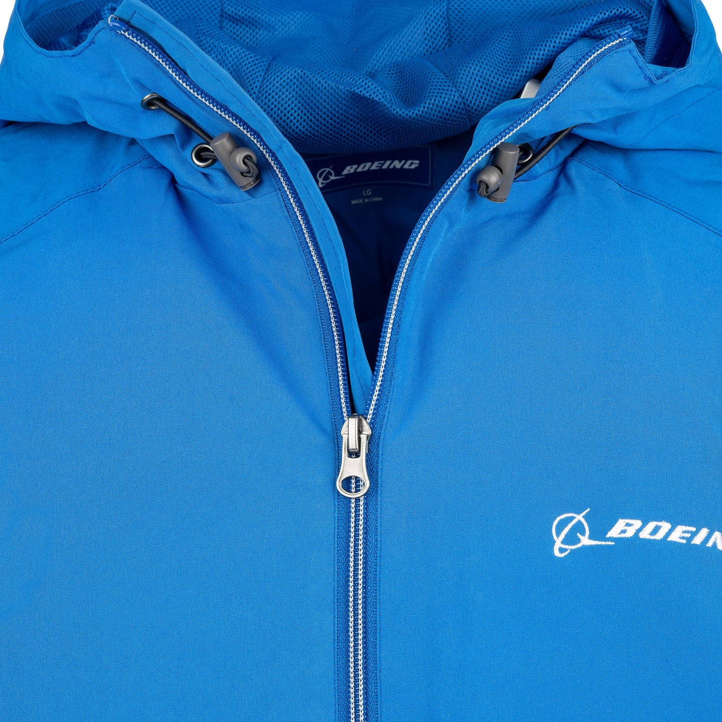 Close-up of royal blue Boeing Newport jacket hood and front zipper detail