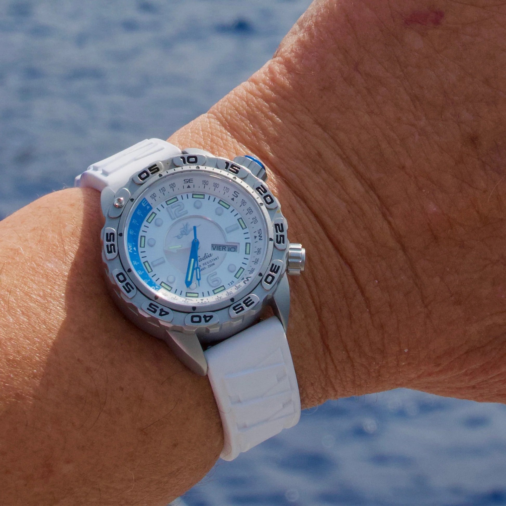 Nadia Whitewater Automatic Dive Watch with White Silicone Strap and Stainless Steel Case, shown on wrist with ocean background