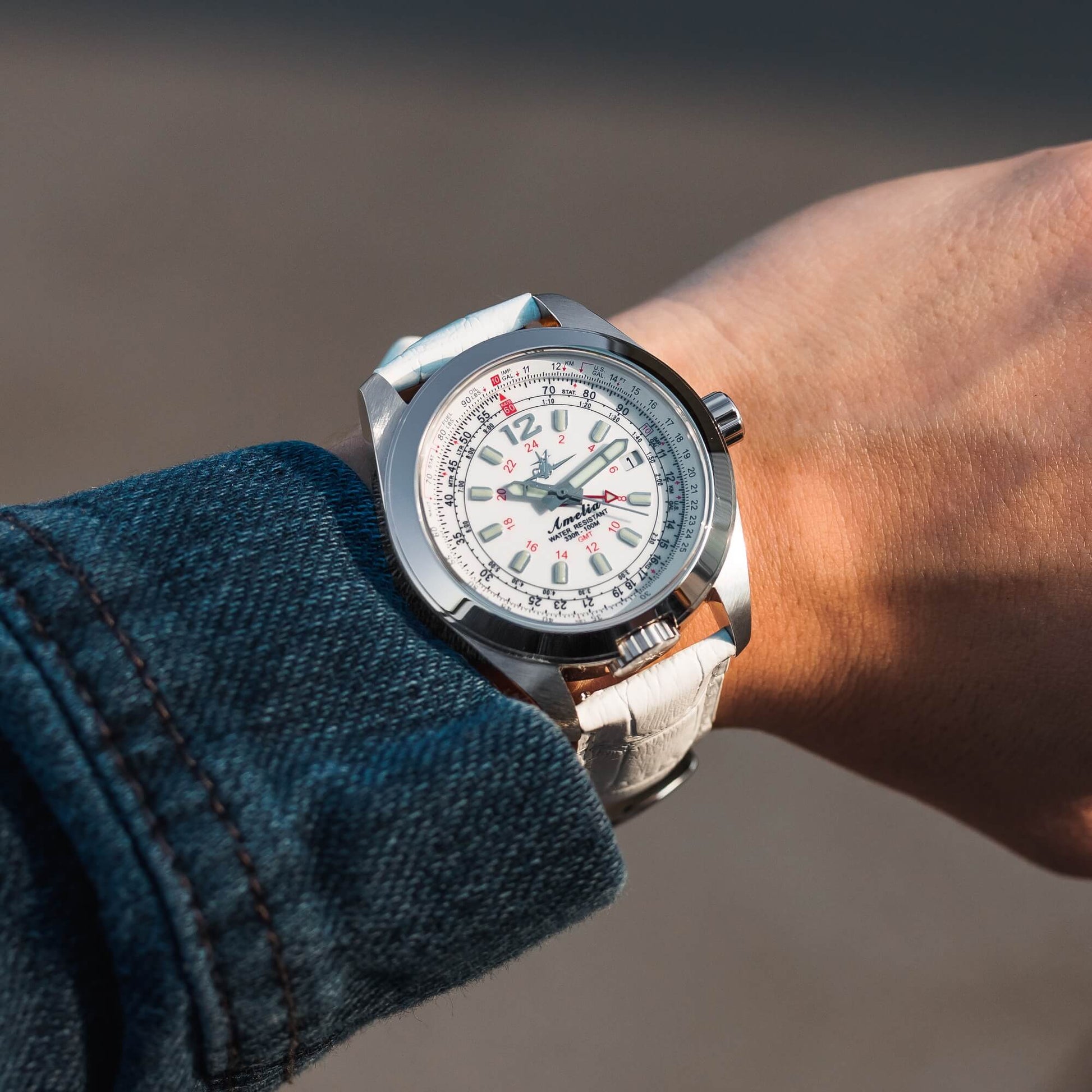 Amelia Women's Pilot Watch with Cloud White Dial and White Leather Strap, Worn on Wrist Outdoors, Featuring GMT Hand and E6B Flight Computer Bezel