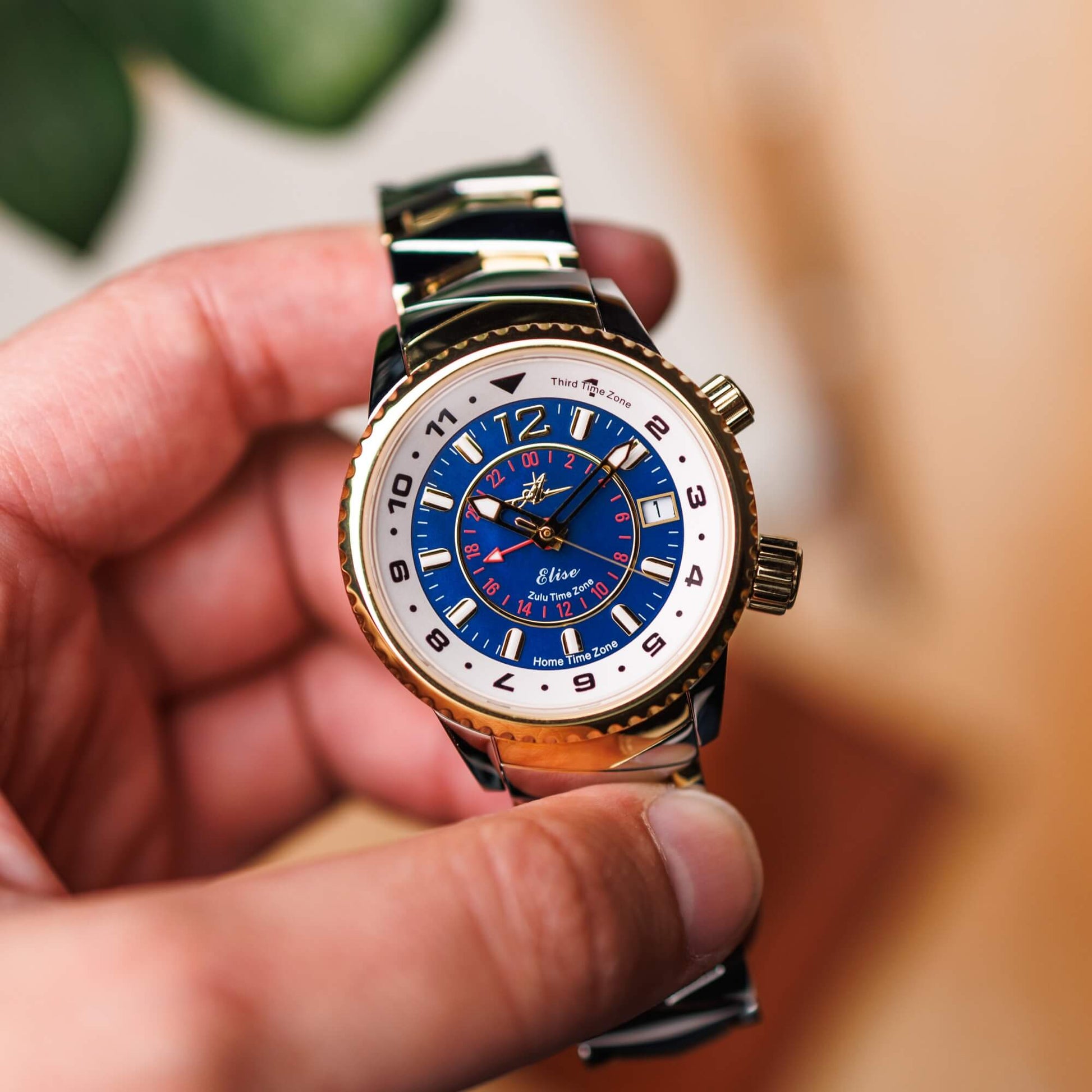 Elise Midnight Blue Dial Watch Held in Hand – Two-Tone Bracelet and 24-Hour Inner Dial