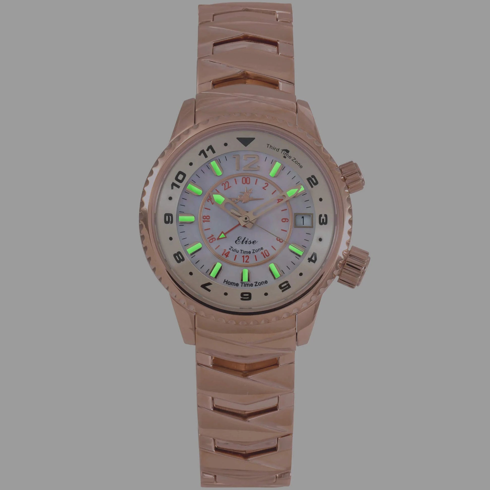 Elise Rosy watch in low light showing green and blue luminescent hour markers and hands.