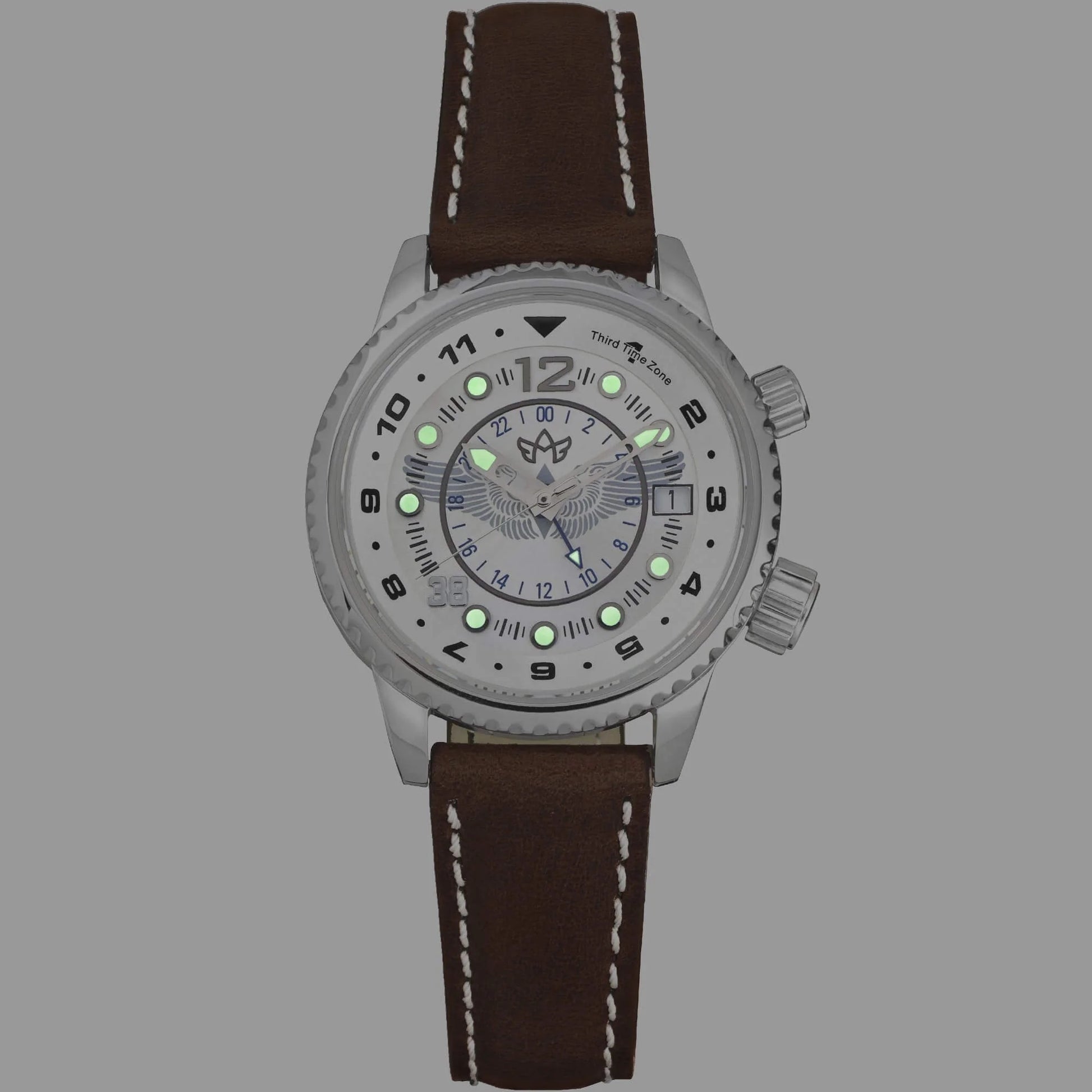 WASP Silver Limited Edition GMT Watch with Super‑Luminova Hands and Markers Glowing on Mother-of-Pearl Dial in Low Light