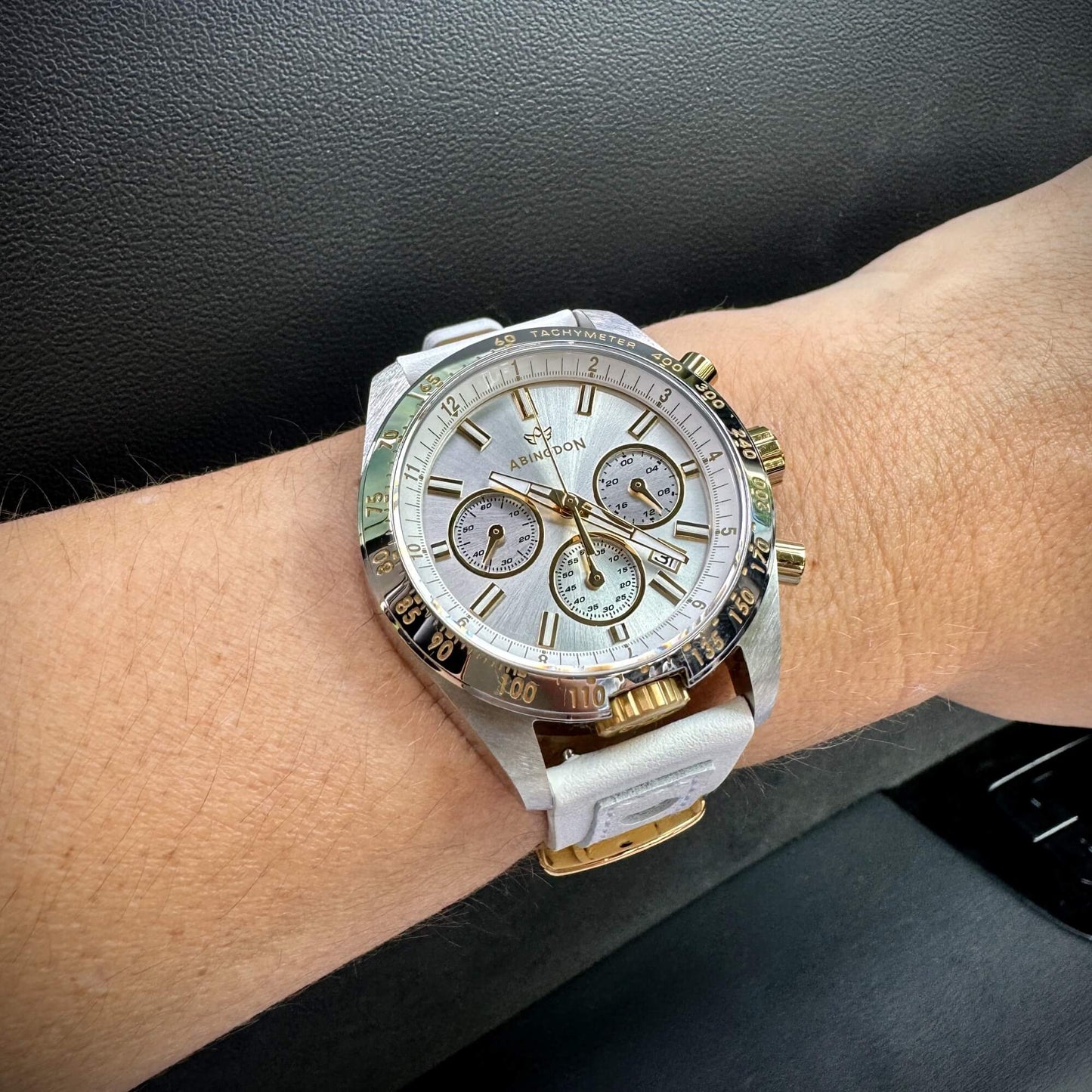 Jordan Women’s Pilot Watch with Champagne Dial, Gold and Silver Case, White Leather Band, Shown on Wrist with Chronograph and Tachymeter Bezel