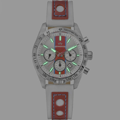 Jordan Women’s Pilot Watch with Victory Red Dial and White Leather Strap, Shown Glowing with Super-Luminova Hands and Hour Markers in Low Light