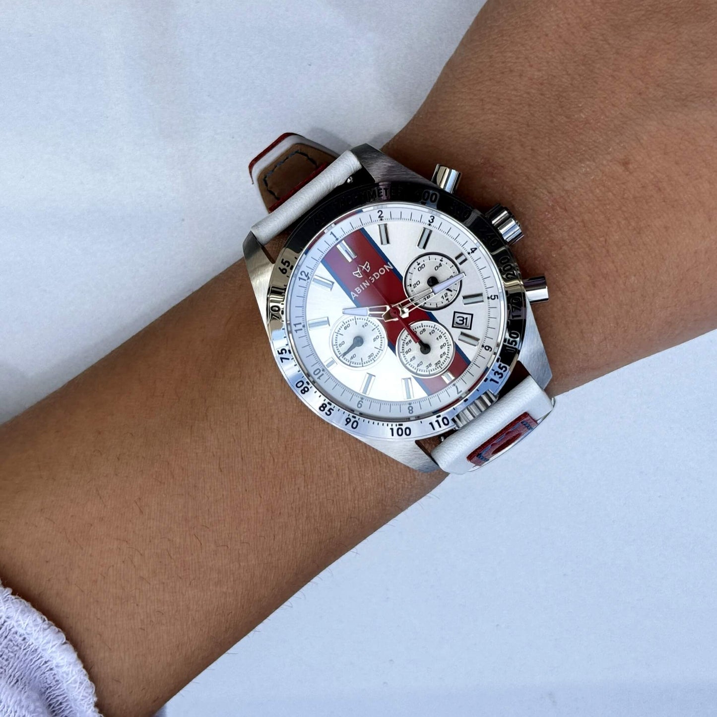 Jordan Women’s Pilot Watch with Victory Red Dial and White Leather Strap, Shown on Wrist with Chronograph and Silver Tachymeter Bezel