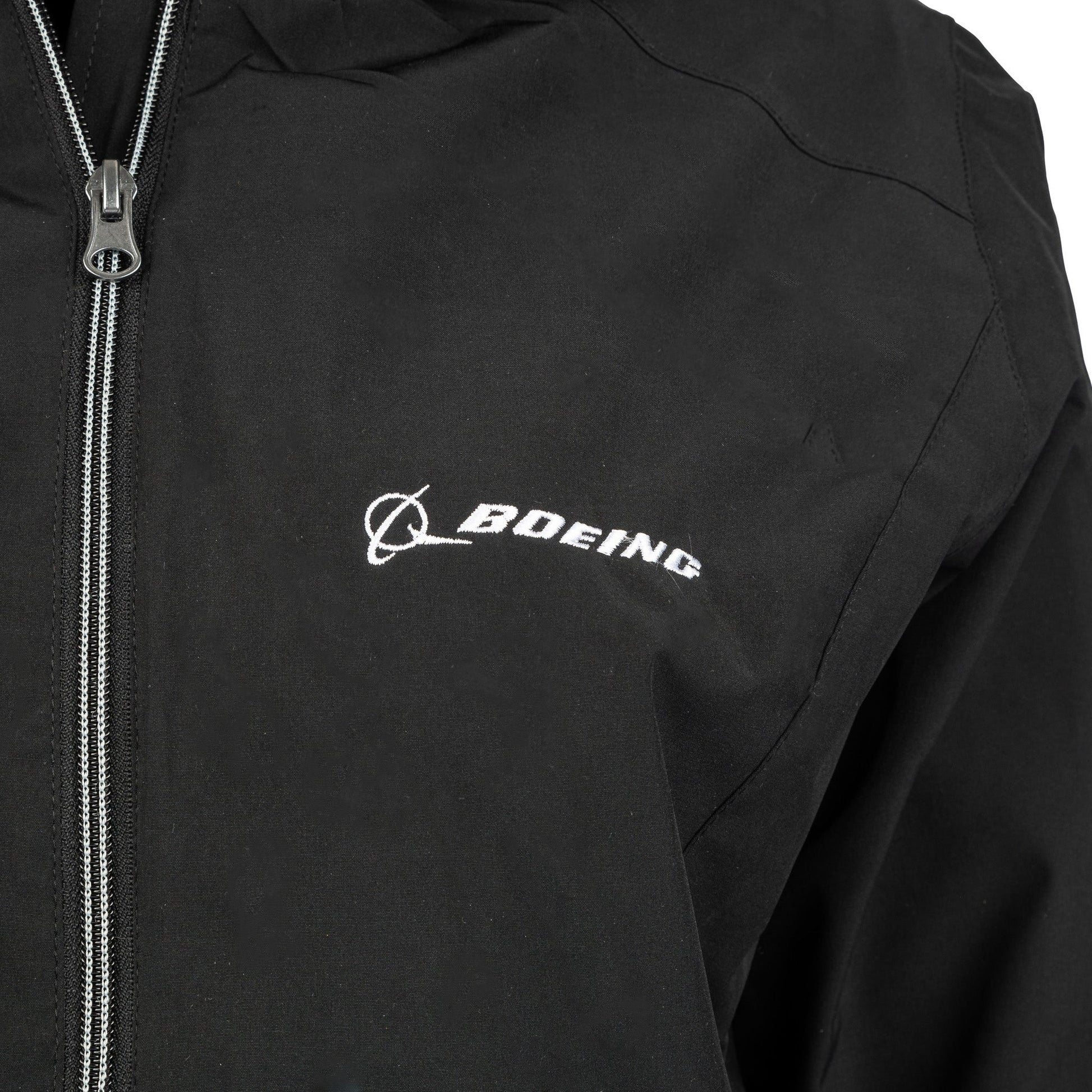 Detail view of black Ladies Boeing jacket embroidered Boeing logo on chest