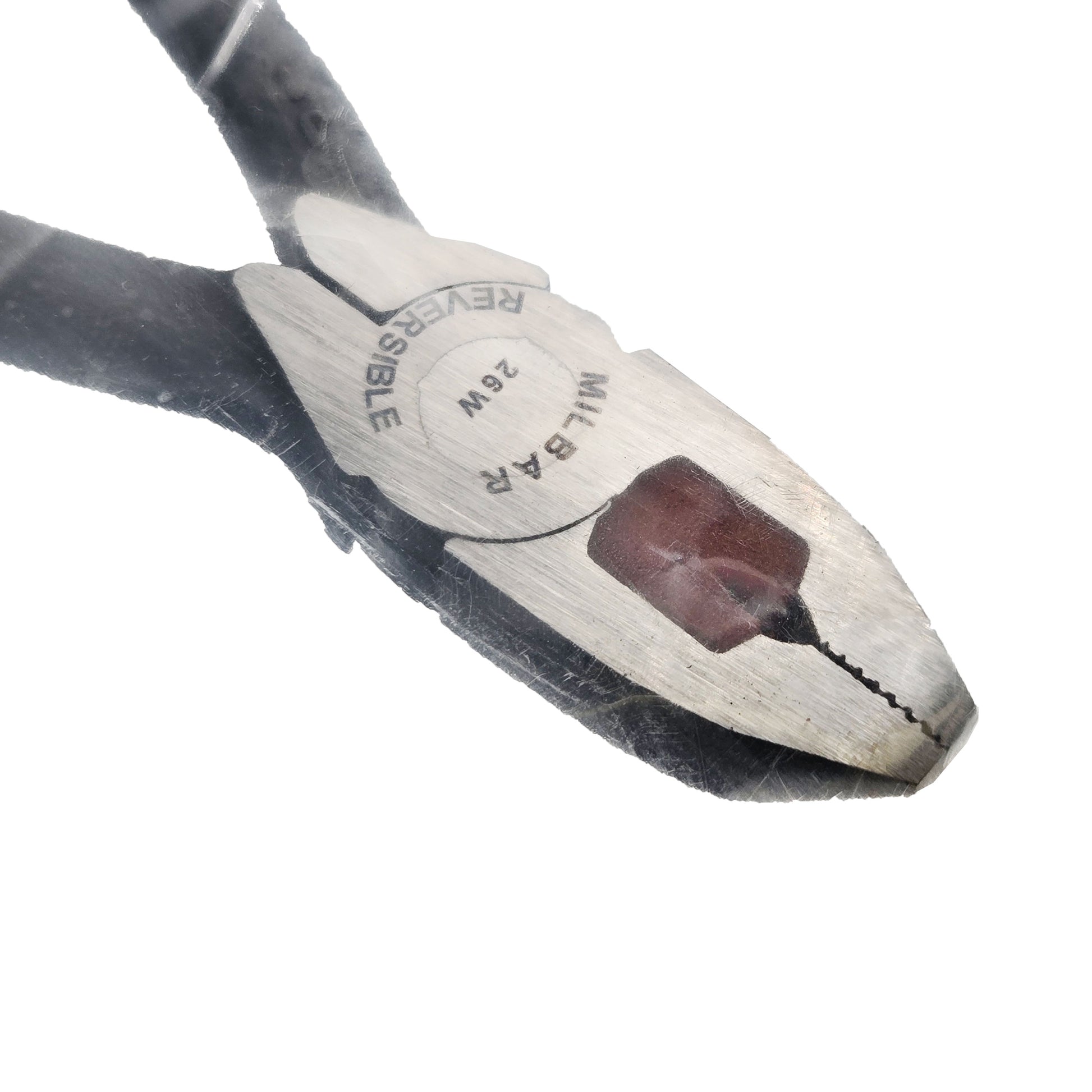 Top close-up of Milbar 26W reversible pliers head showing engraved branding and serrated gripping surfaces