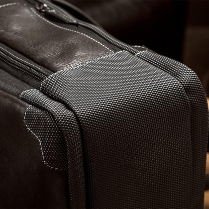Close-up of the bag’s durable leather handle and stitching detail