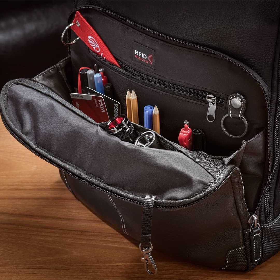 Interior view of main compartment with organized pilot gear and pens