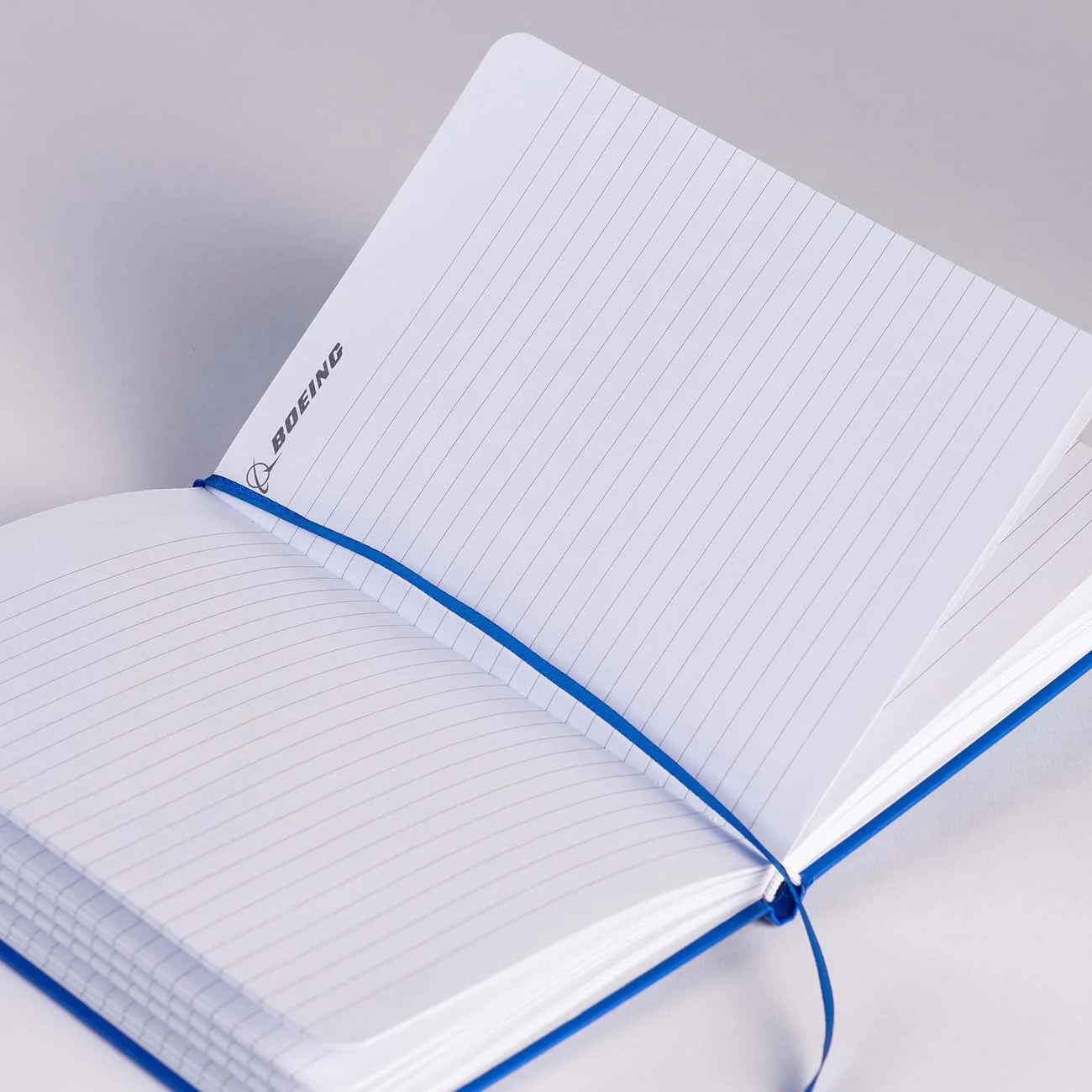 Open Boeing Basic Notebook showing lined pages and ribbon bookmark