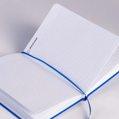Open Boeing Basic Notebook showing lined pages and ribbon bookmark