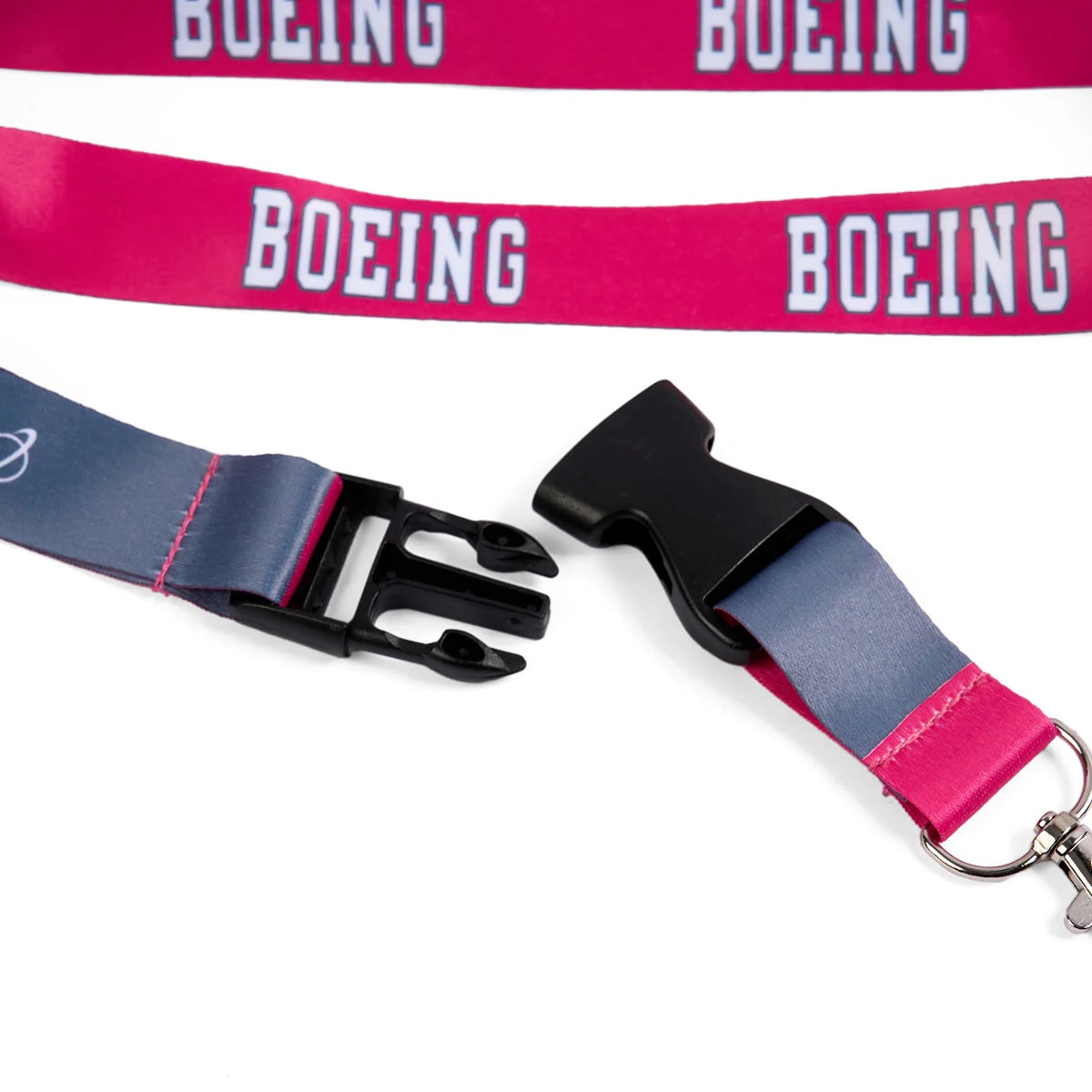 Close-up of Boeing varsity pink lanyard quick-release buckle and key clip