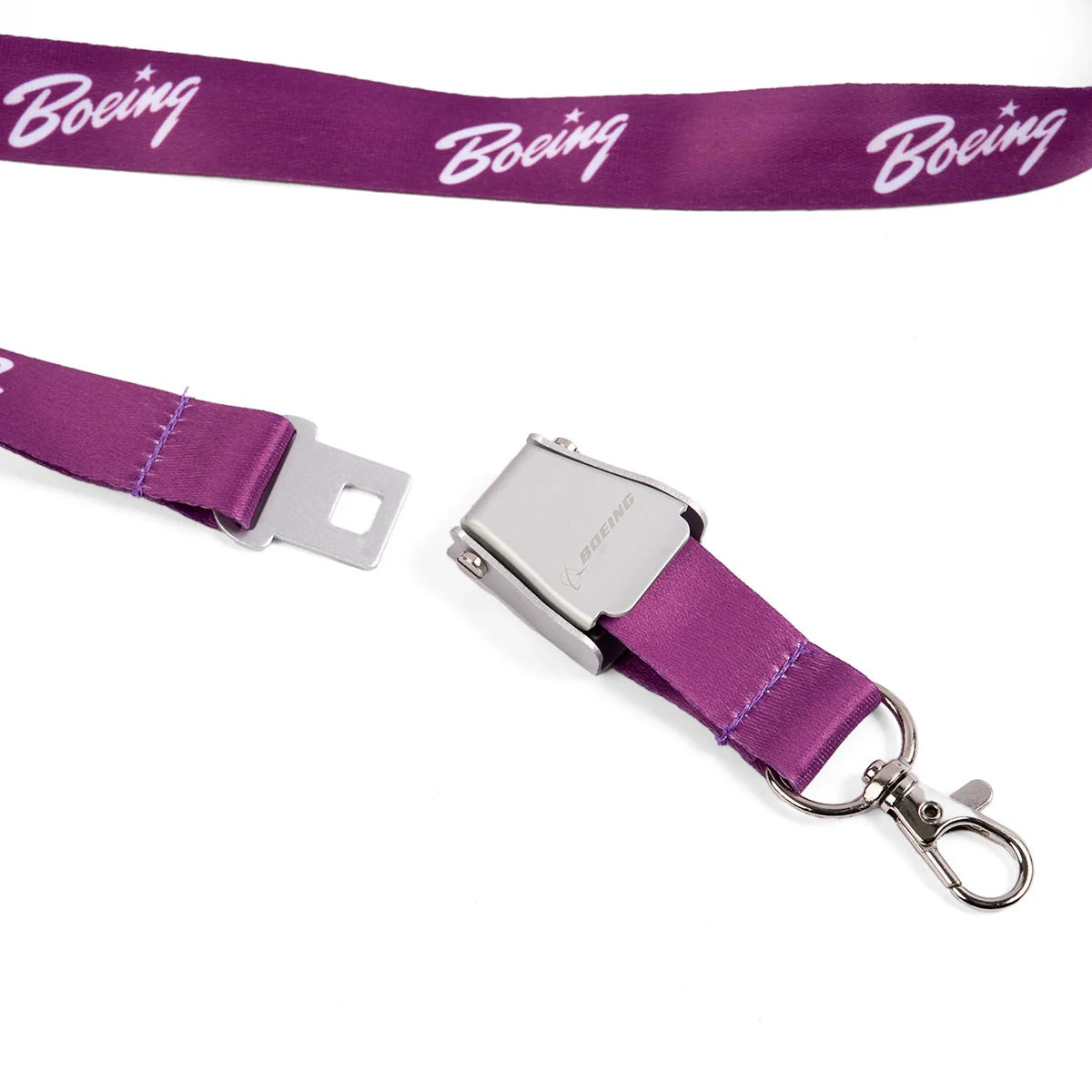 Close-up of Boeing purple seat belt buckle lanyard with engraved metal buckle and clip