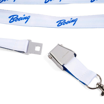 Close-up of Boeing blue seat belt buckle lanyard showing metal buckle and detachable clasp