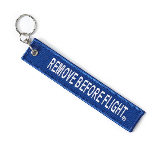 Boeing Remove Before Flight keychain blue fabric tag with white Remove Before Flight lettering