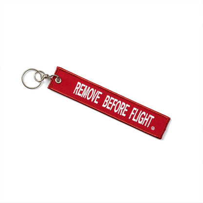 Boeing 737 Remove Before Flight keychain red fabric tag with white Remove Before Flight lettering