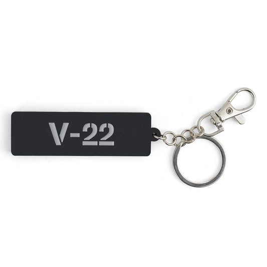 Boeing V-22 Osprey Series rubber keychain in black with raised gray lettering and metal keyring clip