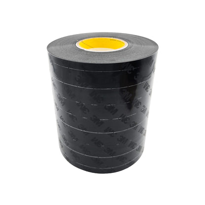 Full roll of 3M 8663 black polyurethane protective tape with yellow core, outer layer printed with 3M logo, on white background