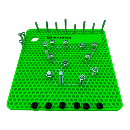 Original Boltster in green silicone fastener organizer with labeled bolt pattern layout