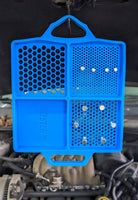 Boltster™ Flexible Organizing Tray hanging under a vehicle hood with bolts secured in compartments during engine work