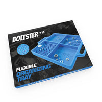 Retail packaging of the Boltster™ Flexible Organizing Tray in blue, showing tray layout and branding on a black background