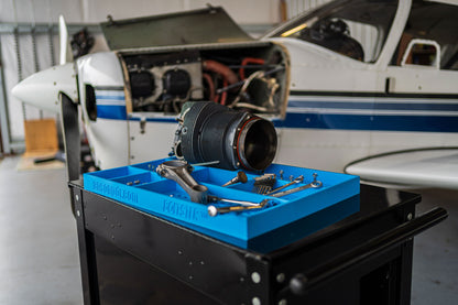 Boltster™ Top Box Tool Tray in blue used during aircraft engine maintenance, organized with tools and components on a black tool cart
