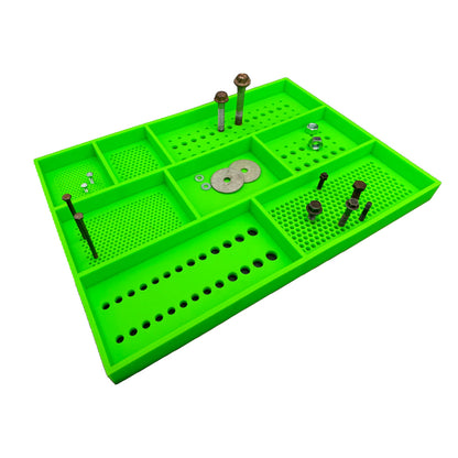 Boltster™ Top Box Tool Tray in green silicone filled with assorted bolts, washers, and fasteners across multiple compartments and linear rows