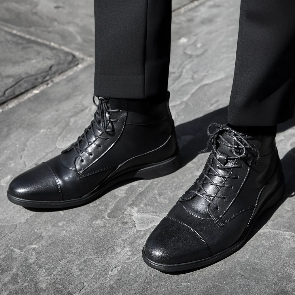 Amberjack The Boot Obsidian black pilot ankle boot, left side view, lace-up aviation boot | Lifestyle Close-up