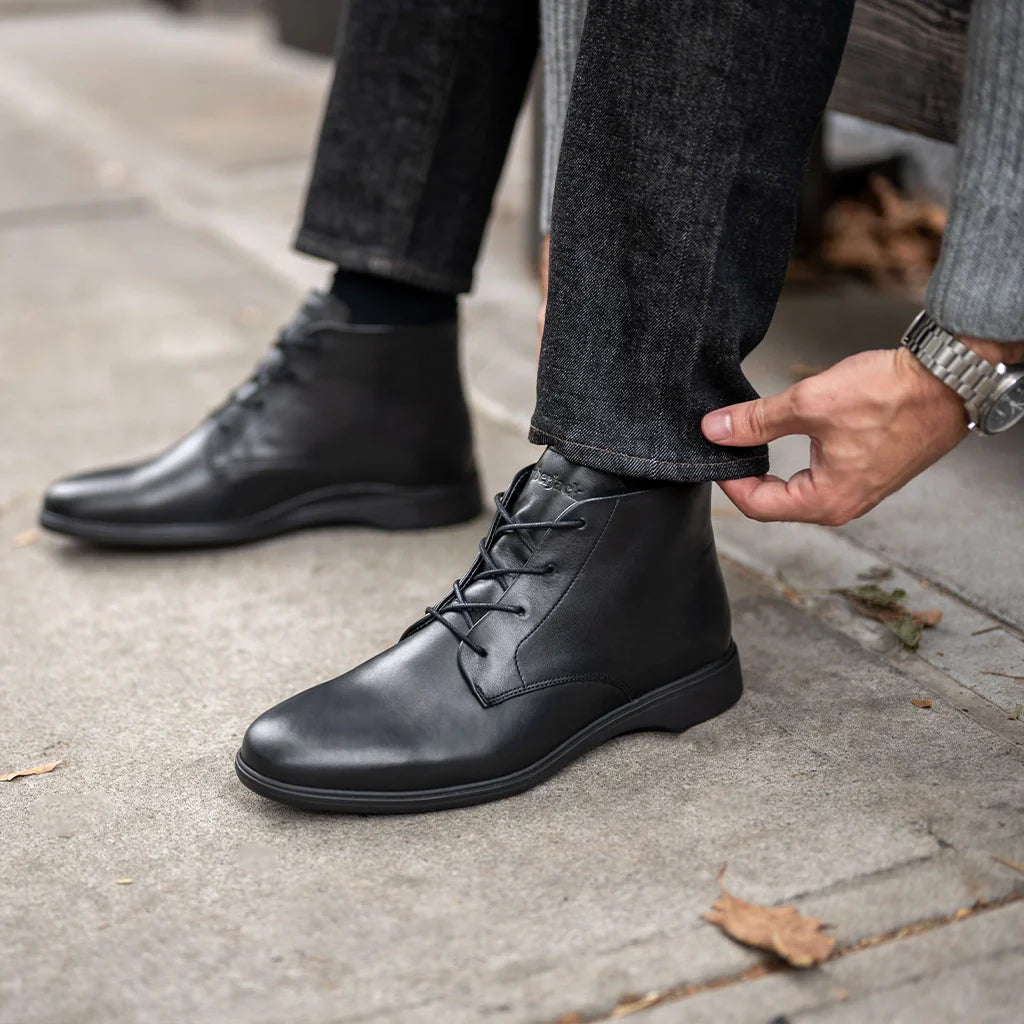 Amberjack Chukka Obsidian black pilot mid-cut boot, left side view, two-eyelet lace-up | Lifestyle Closeup 