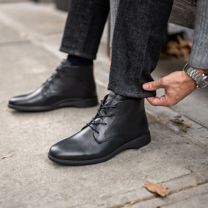 Amberjack Chukka Obsidian black pilot mid-cut boot, left side view, two-eyelet lace-up | Lifestyle Closeup 