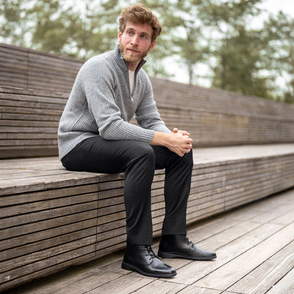 Amberjack Chukka Obsidian black pilot mid-cut boot, left side view, two-eyelet lace-up | Man on a Bench