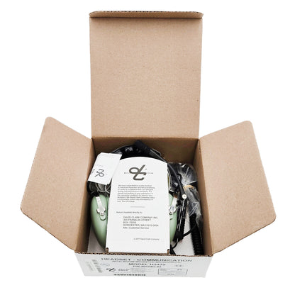 Open box view of David Clark H3432 ground support headset with headset, documentation, and manufacturer instructions inside