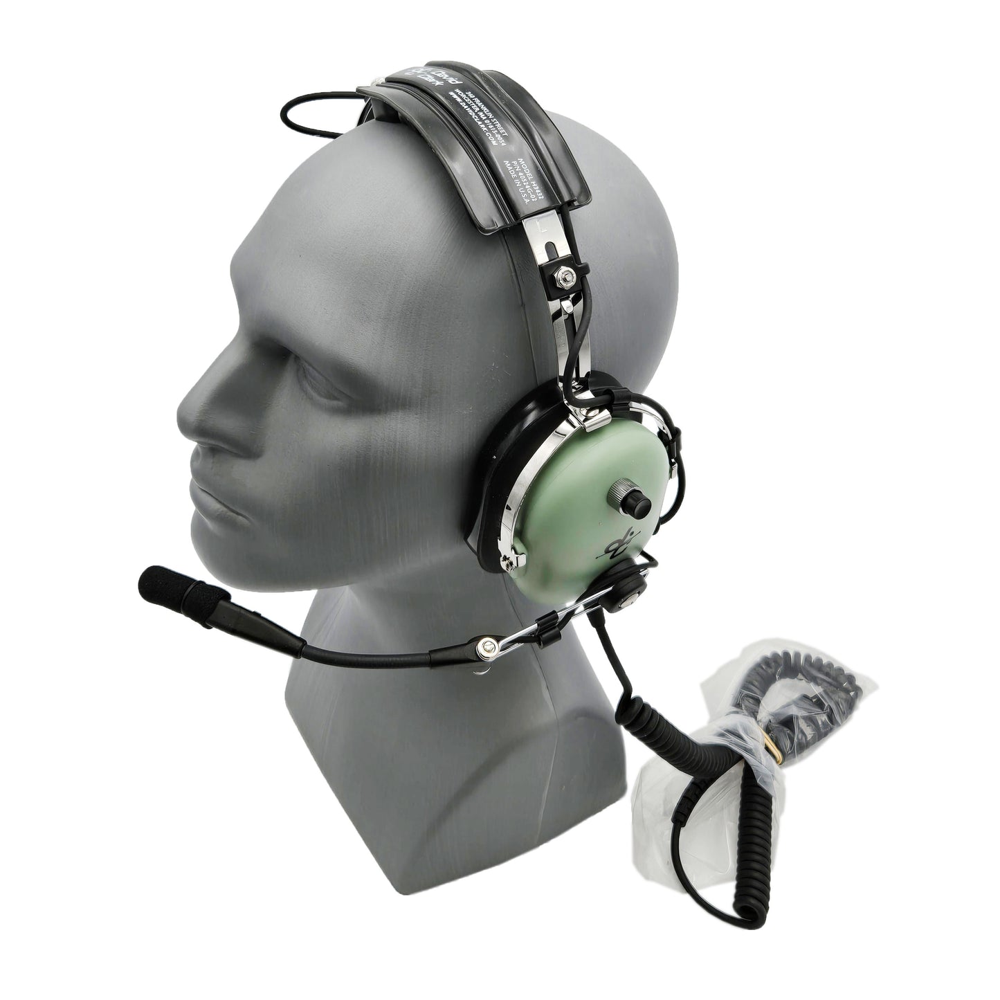 Angled view of David Clark H3432 ground support headset showing boom microphone positioned down and coiled communication cable attached