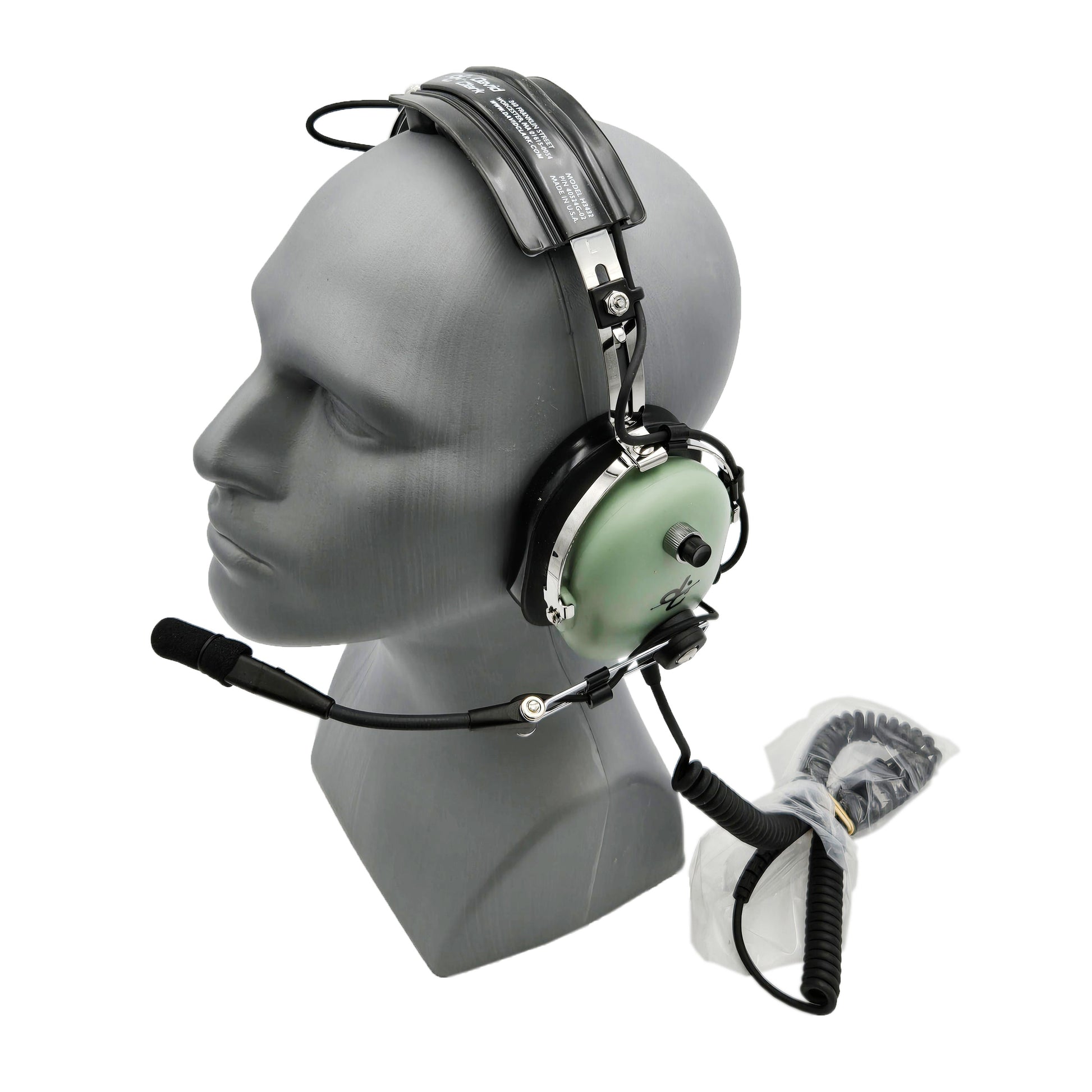 Angled view of David Clark H3432 ground support headset showing boom microphone positioned down and coiled communication cable attached