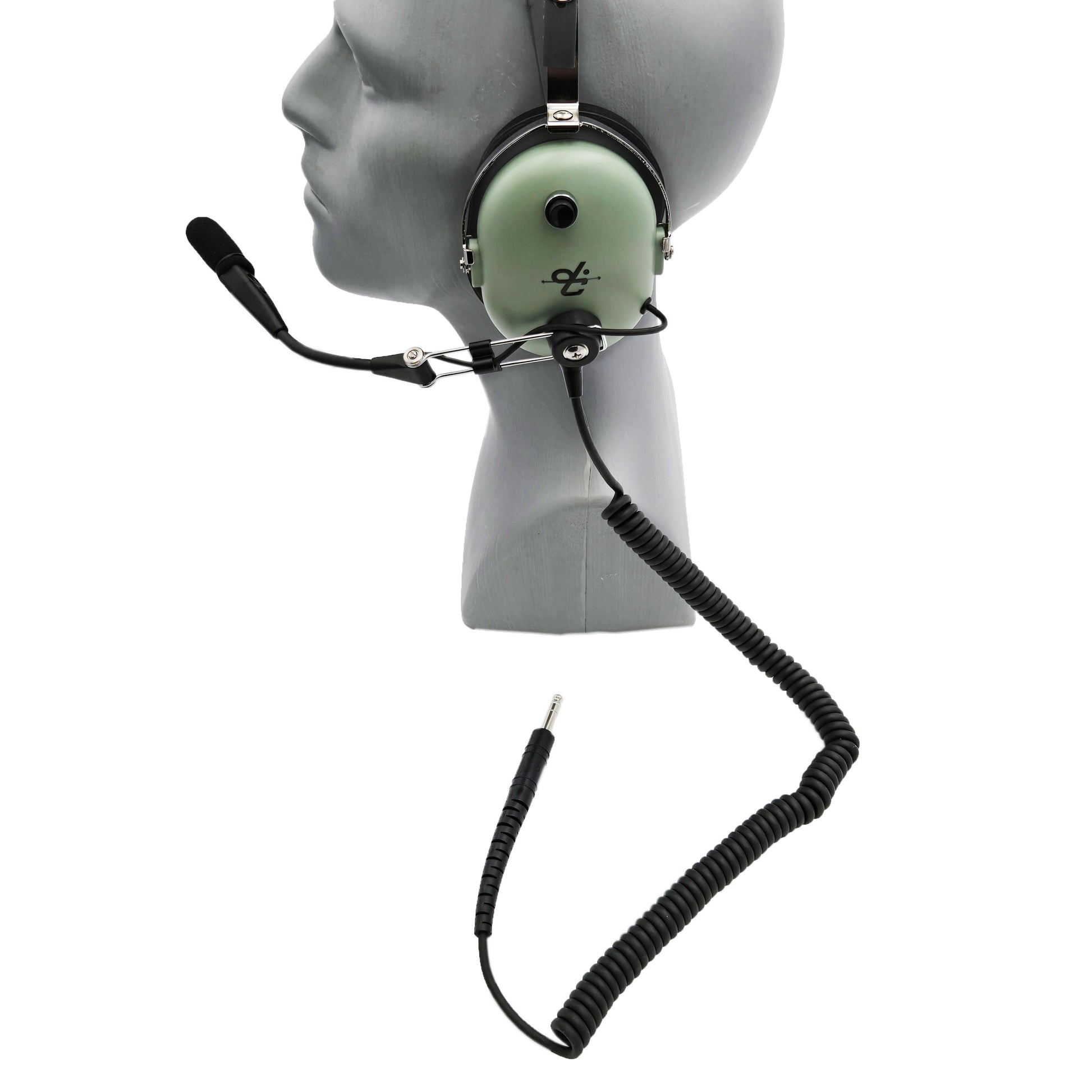 Left-side profile of David Clark H3492 headset showing ear cup with microphone on-off button and coiled cord with 1/4-inch plug