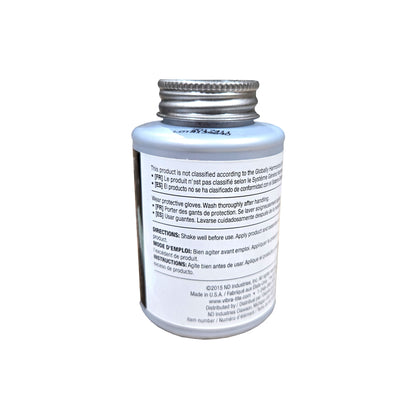 Side label of expired Vibra-Tite 9071 copper anti-seize with non-GHS classification note, safety advice, and application directions