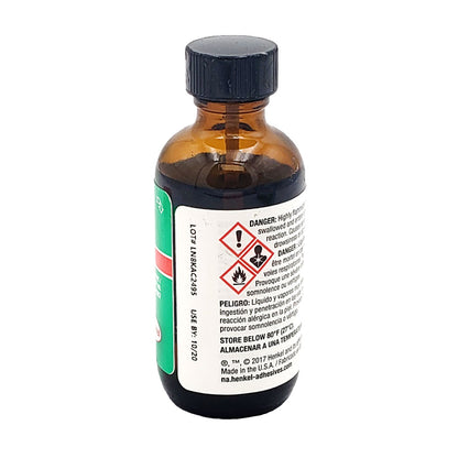 Side view of Loctite 7471 primer bottle showing lot number LN8KAC2495, use-by date, and GHS hazard symbols for flammability and health warnings.
