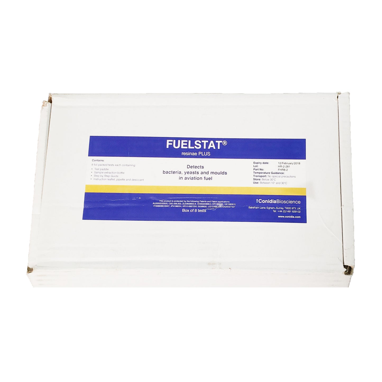 Empty silver foil pouch from expired FuelStat Resinae Plus aviation fuel test kit shown against white background.