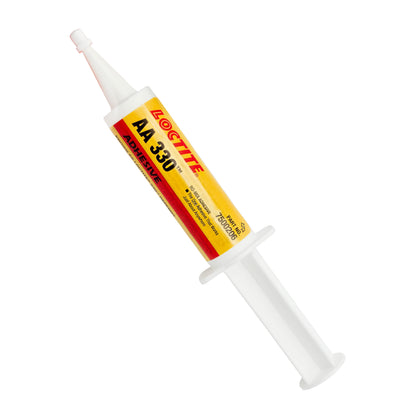 Front view of expired Loctite AA 330 Adhesive syringe showing yellow and red label with Henkel branding.