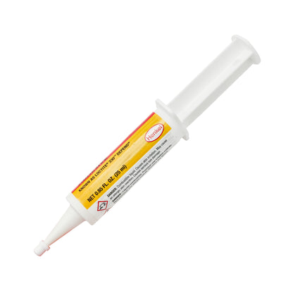 Side view of expired Loctite AA 330 Adhesive syringe with plunger visible and product details printed on label.