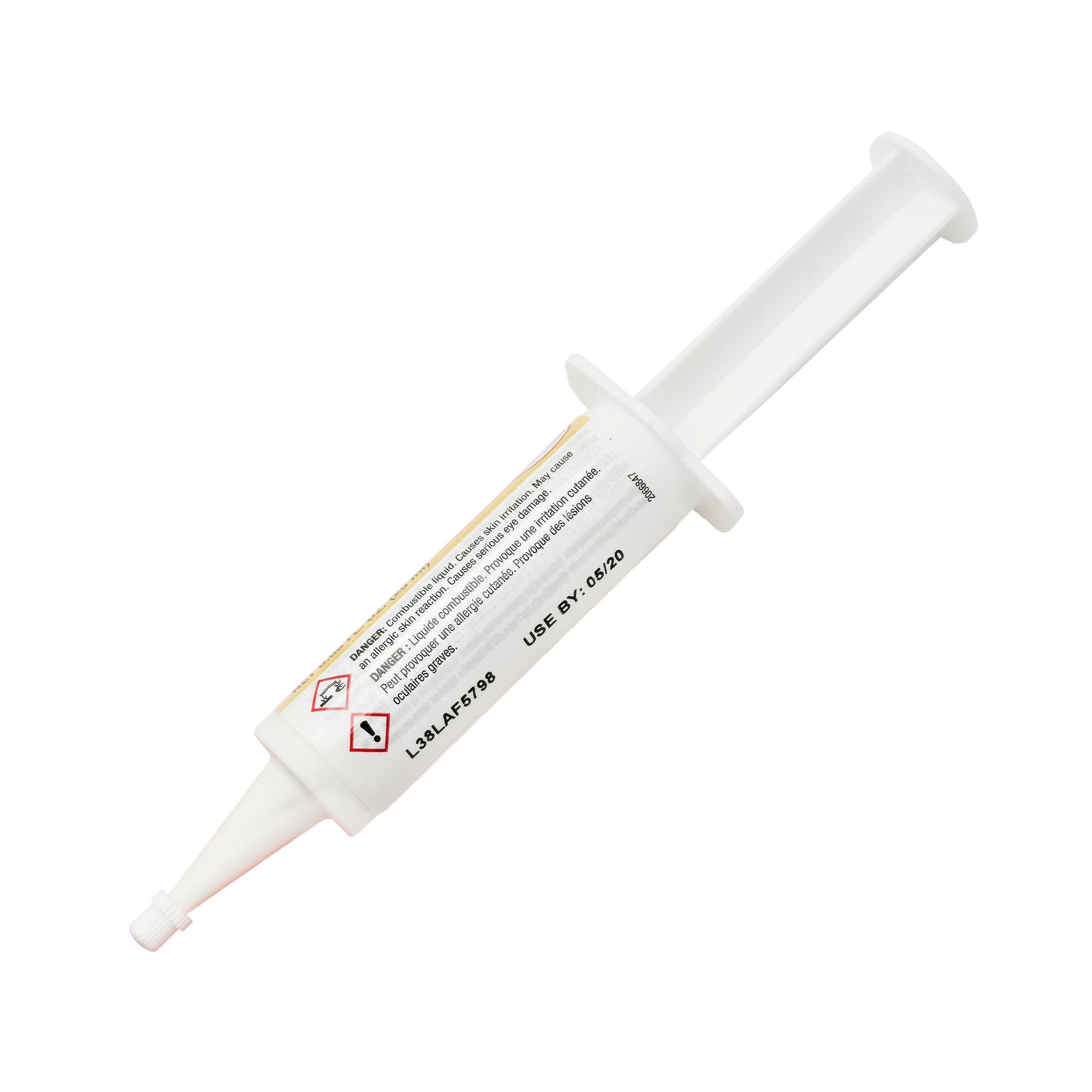 Back view of expired Loctite 330 Adhesive syringe showing printed expiration date May 2020 and warning pictograms.