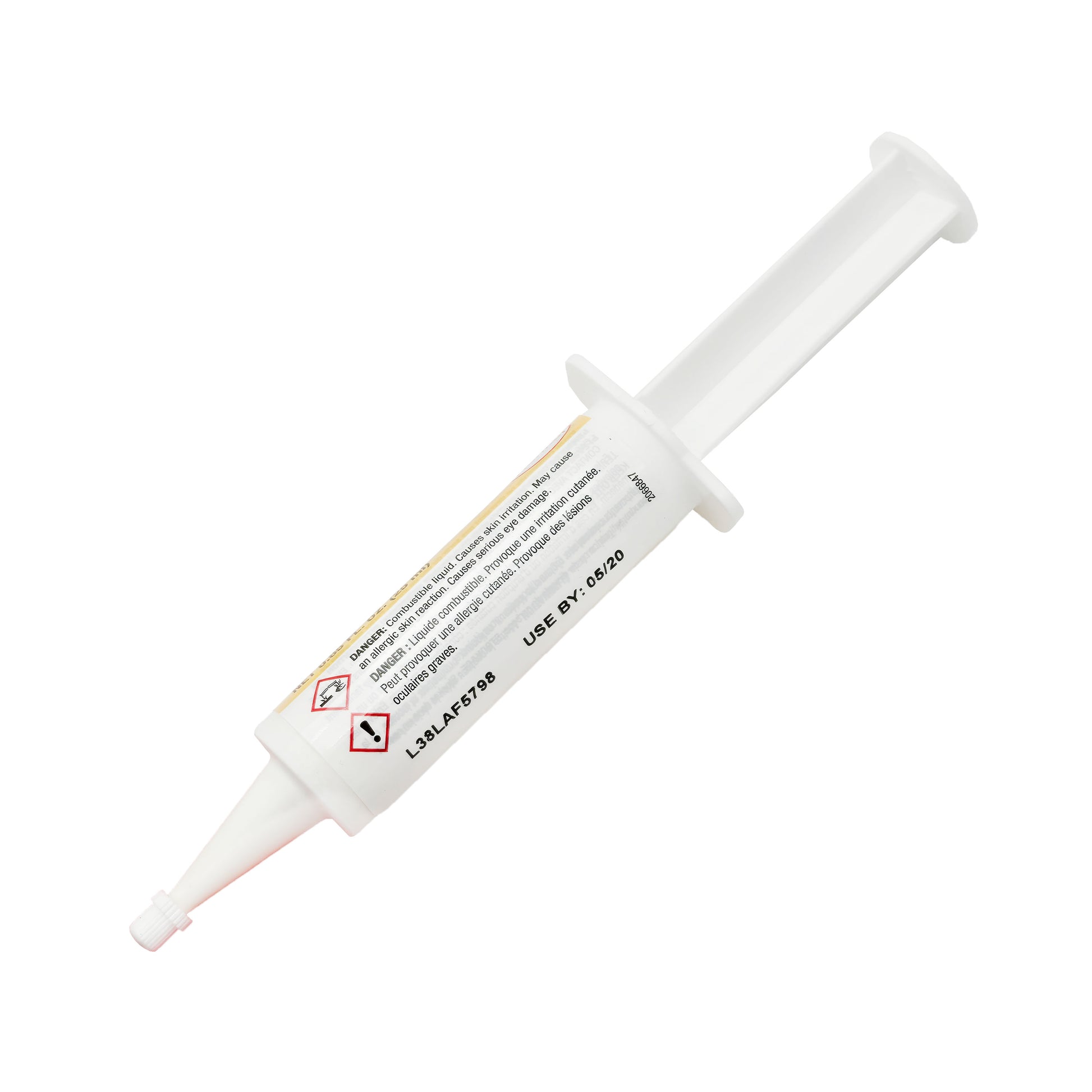 Back view of expired Loctite 330 Adhesive syringe showing printed expiration date May 2020 and warning pictograms.