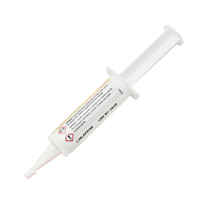 Back view of expired Loctite 330 Adhesive syringe showing printed expiration date May 2020 and warning pictograms.